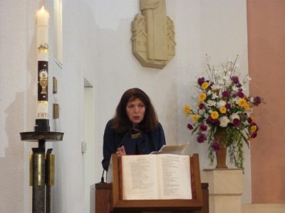 Lilla Szabó discussing architectural style and concept of artistic execution of the Szent László Hungarian Catholic church in New Brunswick, including the stained glass windows, pulpit, baptism font, iconography and history.