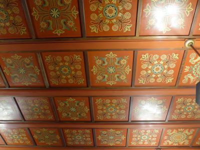Coffered painted ceiling with folk motives.