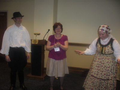 Judy Olson introducing Ilona and Sebestyén Solomon, Táncház teachers